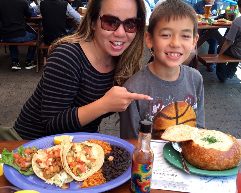 A family enjoys tacos and clam chowder at Wipeout Bar & Grill